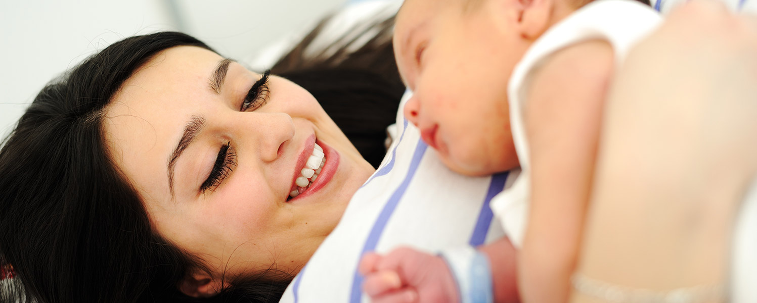 mother with baby lying on her chest