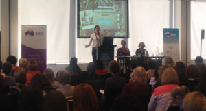 Melanie McGrice Presenting at an event